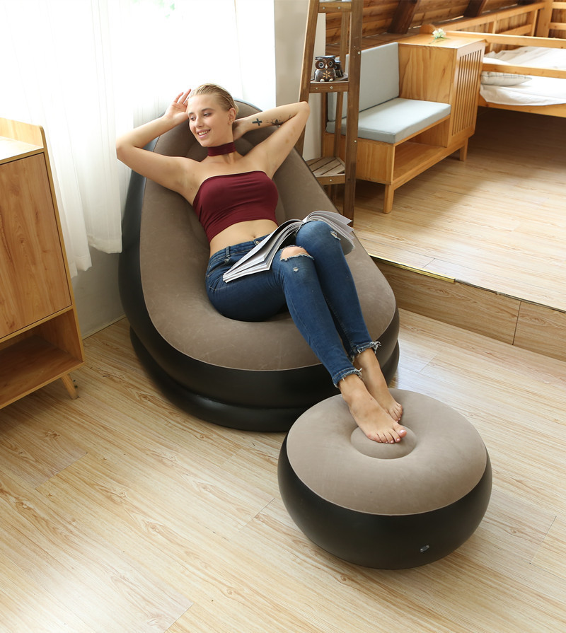 Woman relaxing in brown air sofa